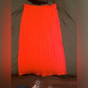 Red slit skirt. Mid length.